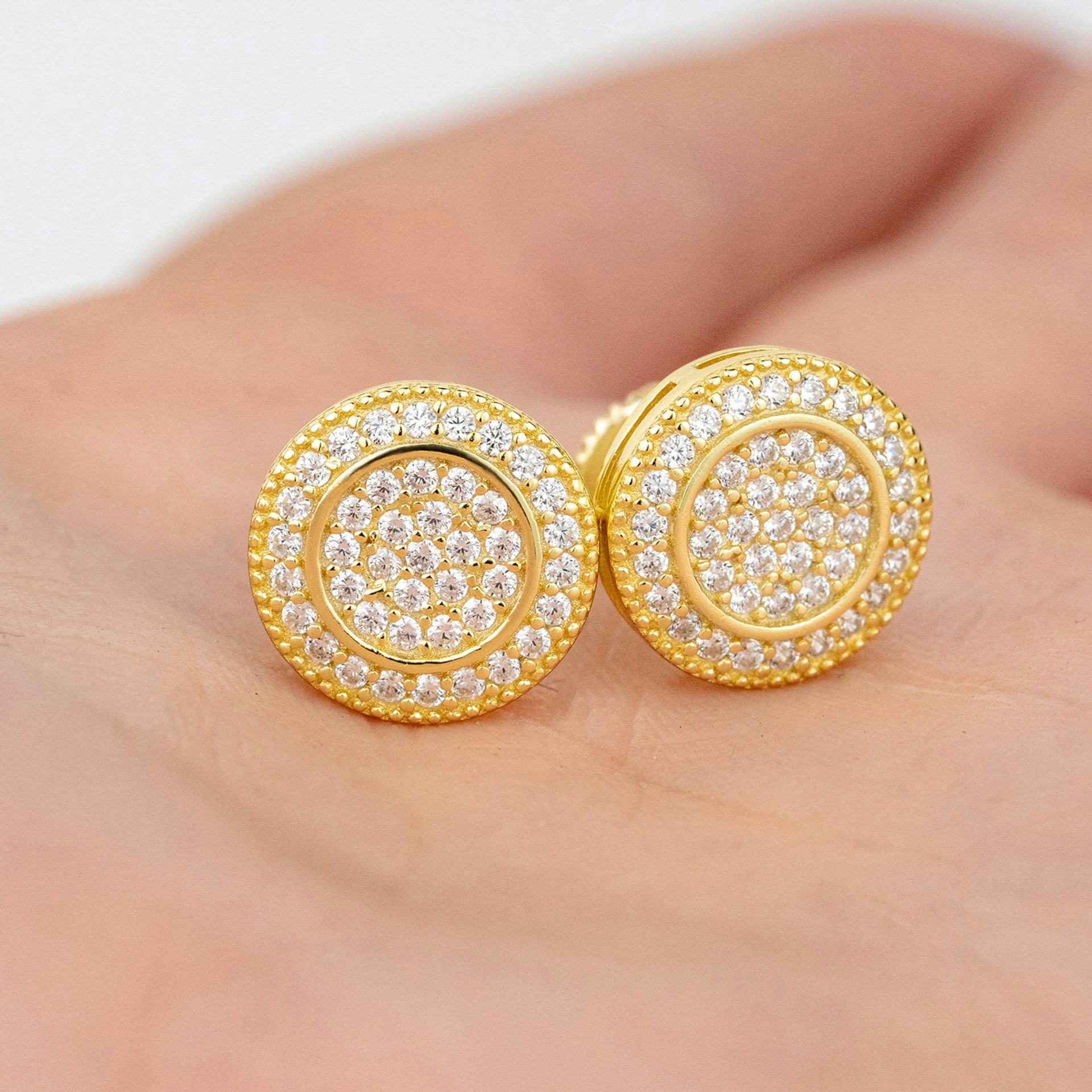 A pair of gold and diamond earrings